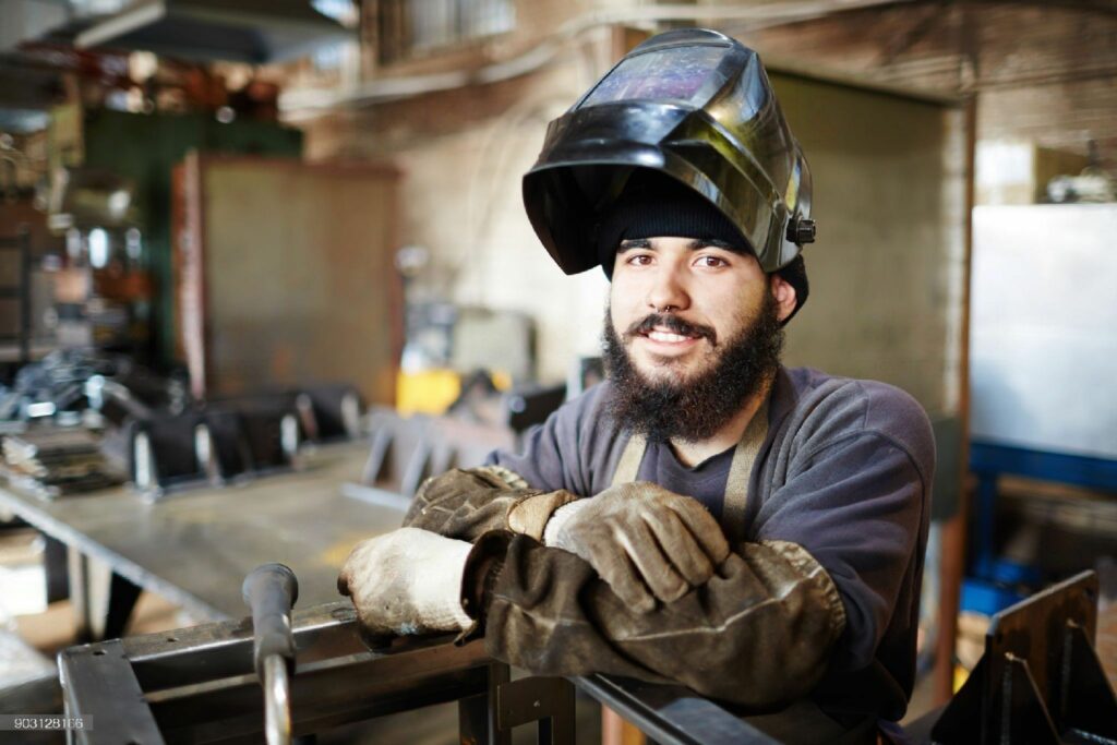 smiling man with welding mask 